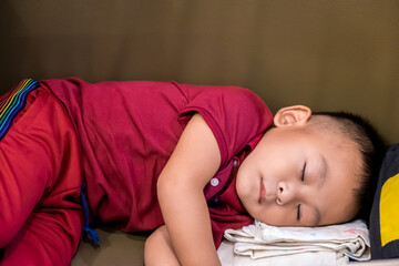 Wall Mural - Asian baby boy sleeping at home.