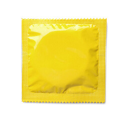 Wall Mural - Yellow condom package on white background, top view. Safe sex