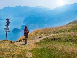 trekking scene on lake como alps (the arrows indicates the names of the locations reached by the tra