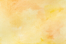 Abstract Watercolor On Paper Wallpaper. Hand Painted Orange And Yellow Watercolor Background.