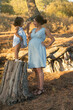 © FotoAndalucia - Pregnant mother comforts angry daughter on tree trunk