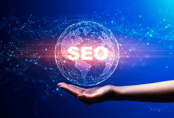 Poster - Hand Holding Holographic World Globe With Word Seo, Blue Background