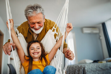 Wall Mural - Happy grandparent playing, having fun with grandchildren