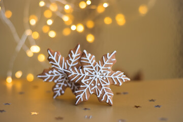 Decorations Christmas gingerbread snowflake cake cookies biscuits. Flat lay, top view, copy space, bokeh