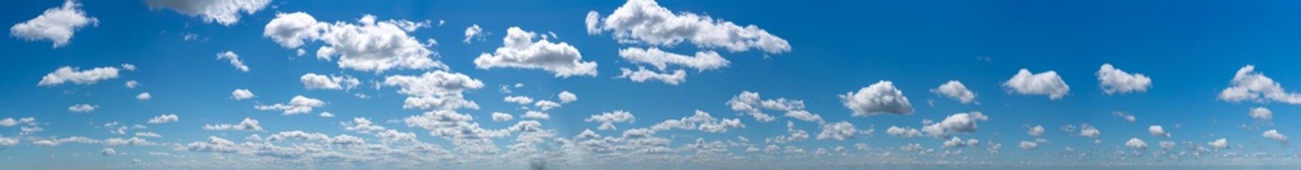 Fantastic clouds against blue sky, panorama