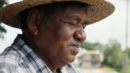 Wall Mural - Elderly Asian man using cellphone outdoors