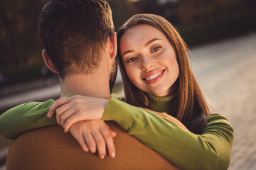 Poster - Back rear spine view portrait of charming positive girl hug her soulmate boyfriend in fall september city center outdoors