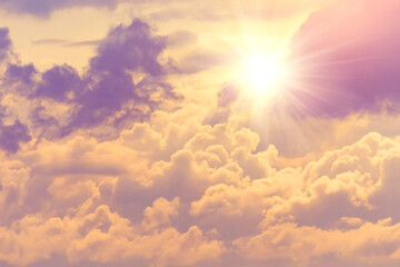 Wall Mural - Sun with bright warm rays through dense clouds divine radiance of the sky.