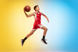 © master1305 - Jump high. Full length portrait of young basketball player in uniform on gradient studio background. Teenager confident posing with ball. Concept of sport, movement, healthy lifestyle, ad, action
