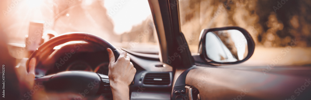 Driver driving a car on asphalt road in summer day - obrazy, fototapety, plakaty 