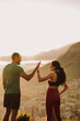© Jacob Lund - Fitness couple standing outdoors giving high five