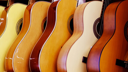 Aufkleber - acoustic guitars stand in rows. musical instruments