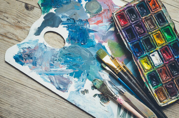 Artist paint brushes and watercolor paintbox