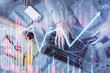 © peshkova - Double exposure of man and woman working together and forex graph hologram drawing. Financial analysis concept. Computer background. Top View.