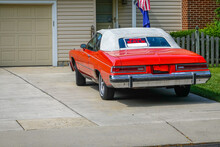 Red Old Historic Car Parked In A Driveway With A White Convertible Roof Has A For Sale Sign In Its Rear Window