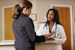 © SuperStock - Doctor and businesswoman examining a brochure