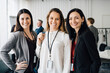 © Maskot - Portrait of female entrepreneurs standing at workplace