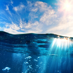 Wall Mural - sky and sea water divided by waterline. ocean aquatic nature design. tropical shining waters