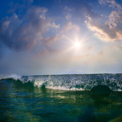 Fototapete - Beautiful sunset at the sea at south summer coast and colorful green blue wave line