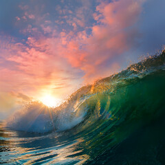 Fototapete - Glossy Ocean Wave under beautiful sunset