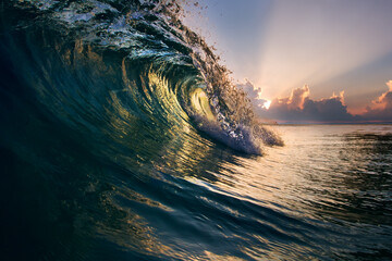 Fototapete - Glossy Ocean Wave under beautiful sunset