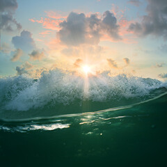 Wall Mural - beautiful sunset with ocean breaking wave and waterline