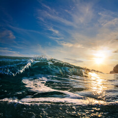 Fototapete - Sunset at the sea with beautiful green wave