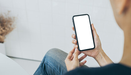 cell phone mockup blank white screen.woman hand holding texting using mobile on desk at coffee shop.background empty space for advertise.work people contact marketing business,technology