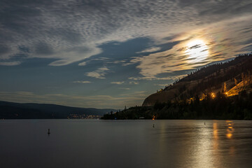 Wall Mural - cloudy sky seen from the shore of Okanagan lake at night British Columbia Canada
