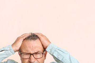 Sticker - Stressed mature man on color background