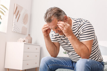 Wall Mural - Stressed mature man at home