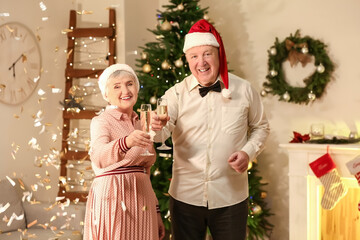 Wall Mural - Elderly couple celebrating Christmas at home