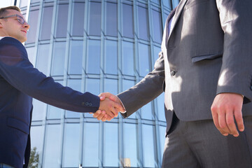 Successful negotiate and handshake concept, two businessman shake hand with partner to celebration partnership and teamwork, business deal.