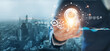 © ipopba - Businessman holding light bulb with gears and cogs inside, Symbolic of creativity innovative solution analysis and development contents of business and process workflow on global network connection.