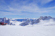 Breathtaking scenic landscape Alpine mountain range view from Zugspitze summit in Bavarian Alps with snow pows or ploughs, glaciers, ski slopes or runs and blue sky