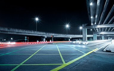 Wall Mural - Freeway in night with cars light in crossroads