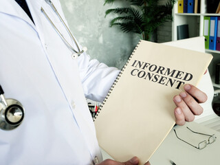 Wall Mural - Doctor shows documents and informed consent form.