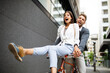 © NDABCREATIVITY - Beautiful happy couple in love on bicycle in the city having fun