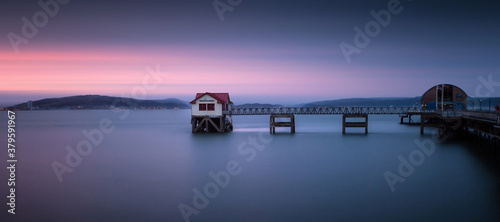 Cuadros en Lienzo The old lifeboat house on Mumbles pier which is no longer in use due to a new one being built, in Swansea Bay, South Wales, UK