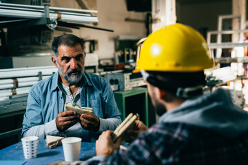 laborers having lunch break in the factory