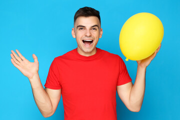 Sticker - Yuong man with balloon on blue background