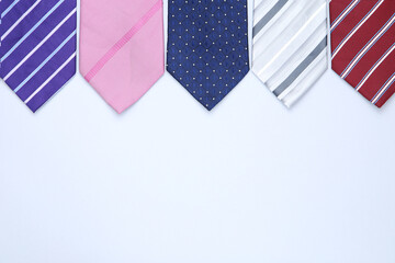 Wall Mural - Colorful neckties on grey background