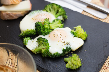 breakfast of crumpled eggs with broccoli