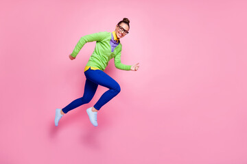 Poster - Full length profile side photo of cheerful lady girl jump run fast hurry want high school education discount wear green shirt blue pants trousers isolated pastel color background