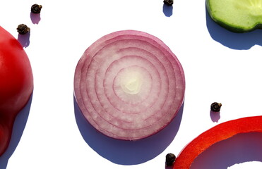 Wall Mural - Purple chopped onion in a ring lies on a white background