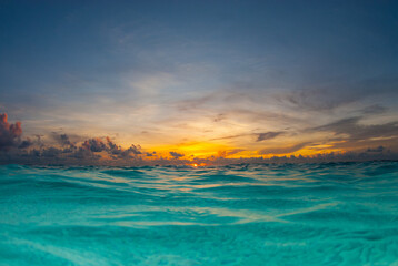 a sunrise shot over the water of the caribbean sea