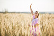 © Alexandr - beautiful young woman in dress in summer field