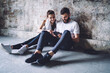 © BullRun - Smiling male and female couple in love checking news from social networks using tablet on break during training, positive sportsman and woman share content about fitness and slimming in blog