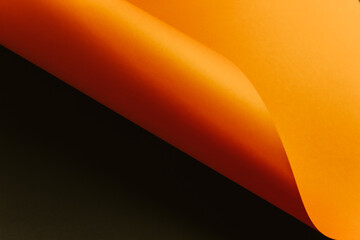 Poster - Orange and black flat lay background with sharp layers, curves and shadows with copy space
