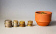 © Tatyana - Growing coins in a ceramic gosh - investment concept